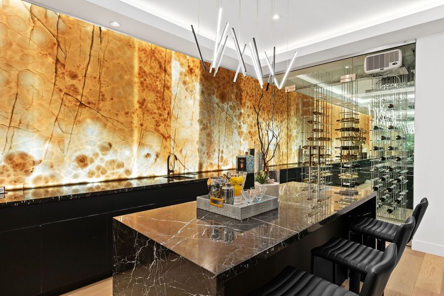 Backlit onyx bar wall and wine cellar